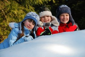 Three children in snow